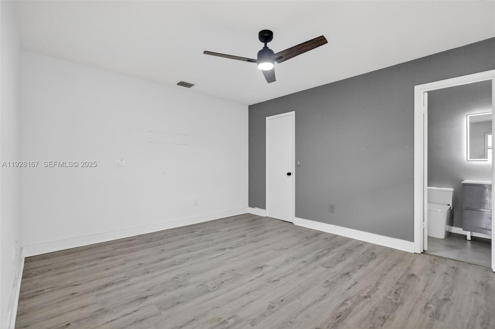 708 Southwest 10th Street, Unit 1 Dania Beach, FL 33004 - Photo 9 of 23 wooden floor in an empty room