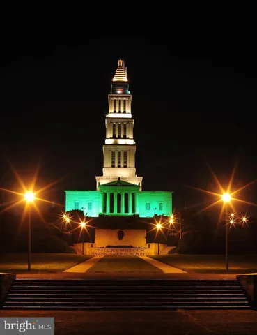 a front view of building with parking