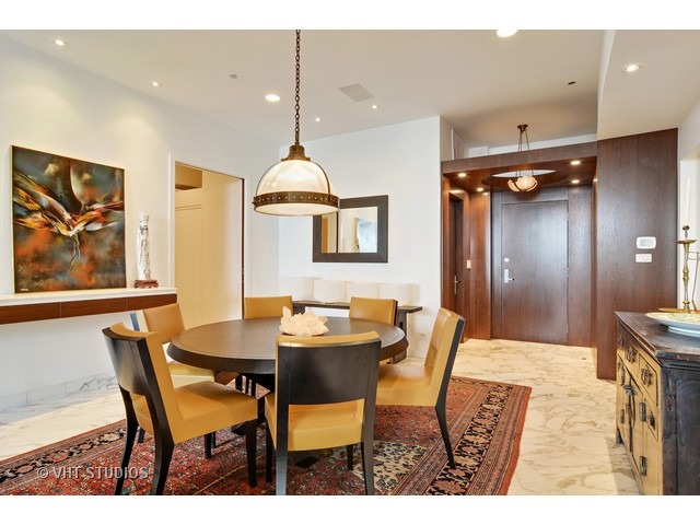 910 South Michigan Avenue, Unit 1101 Chicago, IL 60605 - Photo 2 of 20 a view of a dining room with furniture