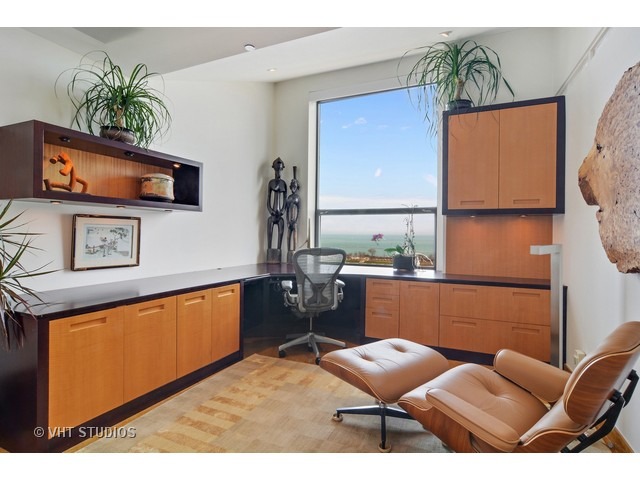 910 South Michigan Avenue, Unit 1101 Chicago, IL 60605 - Photo 11 of 20 a living room with furniture and a flat screen tv