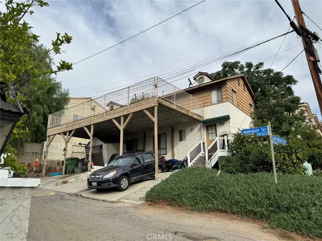 a view of a car park in front of house