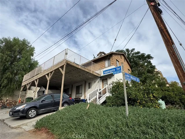 a view of a car park in front of house