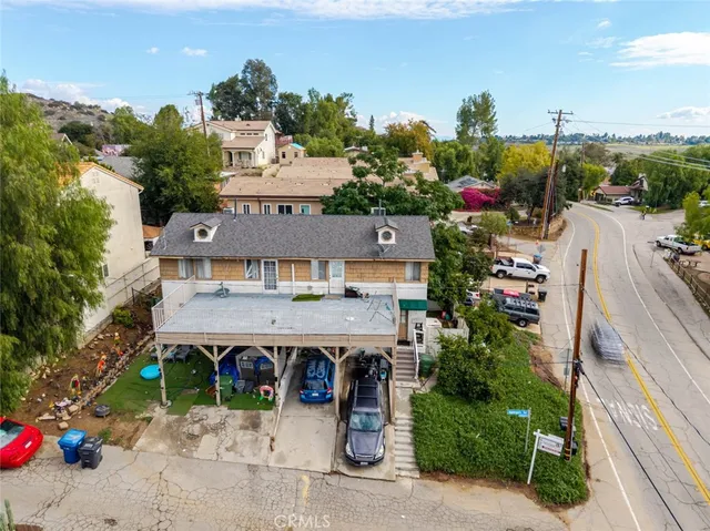 an aerial view of a house with a yard and a garage