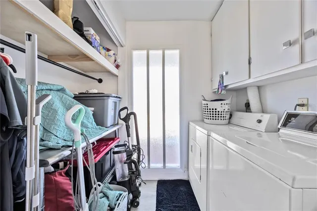 a view of a patio with dining table and chairs potted plants
