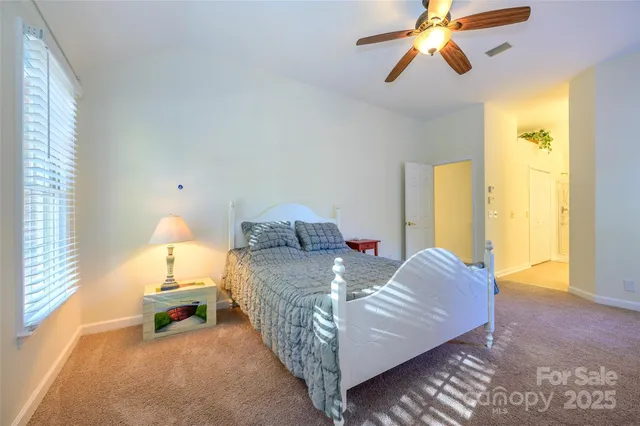 a bed room with a bed and a lamp