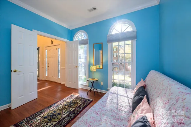 a living room with furniture and a lamp