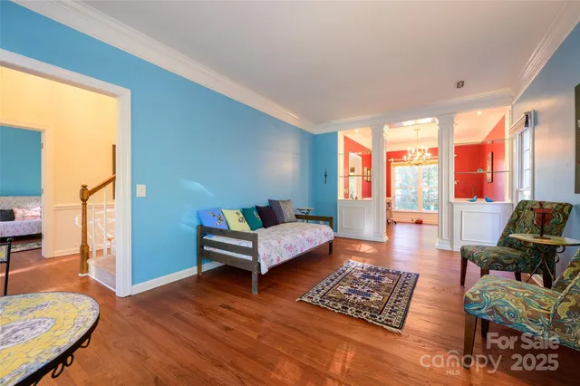 a bedroom with furniture and a window