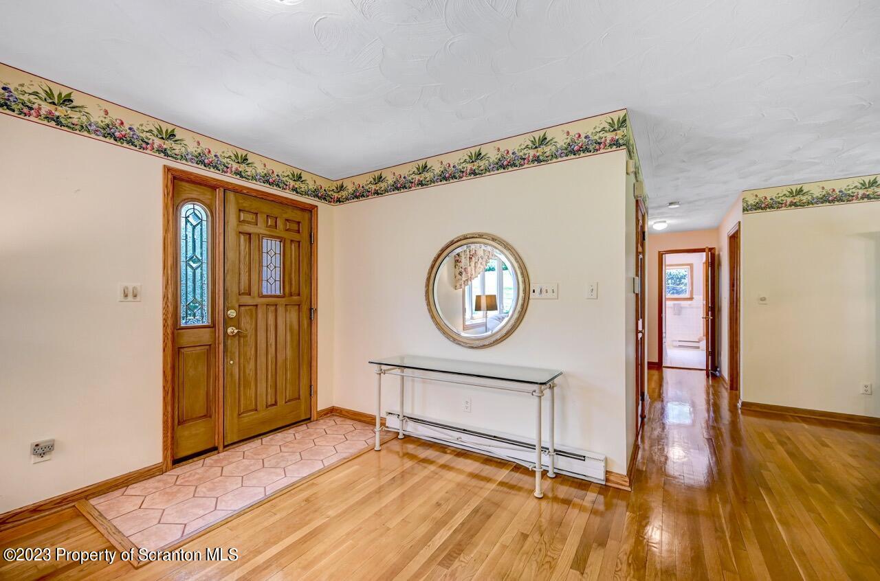 3 T-338 Moscow, PA 18444 - Photo 11 of 62 a view of a room with wooden floor and a window