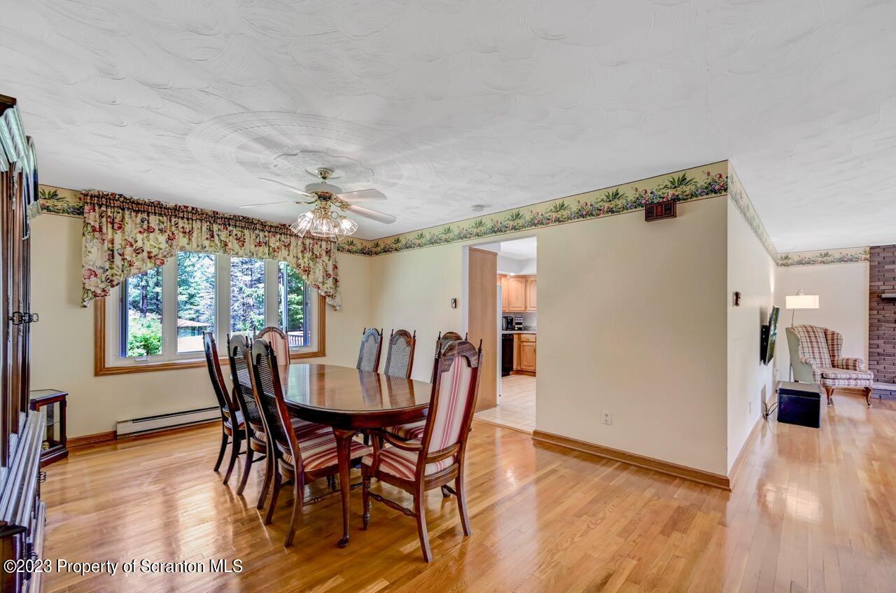 3 T-338 Moscow, PA 18444 - Photo 12 of 62 a view of a dining room with furniture window and wooden floor