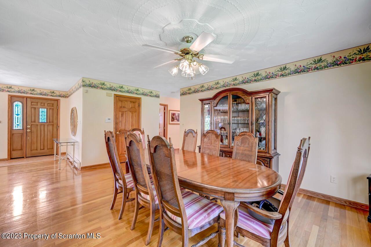 3 T-338 Moscow, PA 18444 - Photo 16 of 62 a view of a dining room with furniture and wooden floor