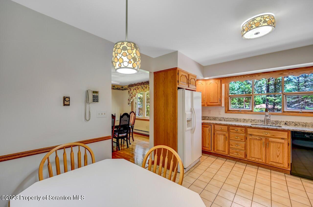 3 T-338 Moscow, PA 18444 - Photo 19 of 62 a spacious bathroom with a double vanity sink a two mirror a window and a bathtub