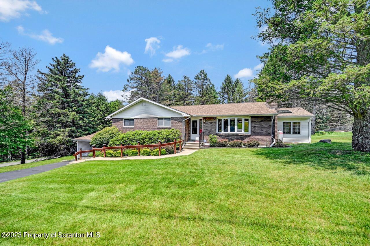 3 T-338 Moscow, PA 18444 - Photo 2 of 62 a front view of a house with garden