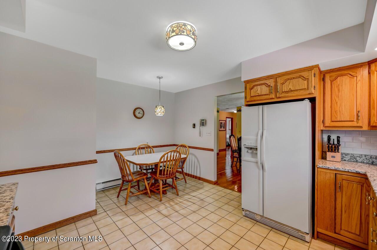 3 T-338 Moscow, PA 18444 - Photo 22 of 62 a view of a kitchen with fridge and table