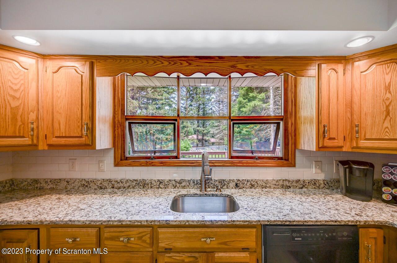 3 T-338 Moscow, PA 18444 - Photo 25 of 62 a kitchen with a window sink and cabinets