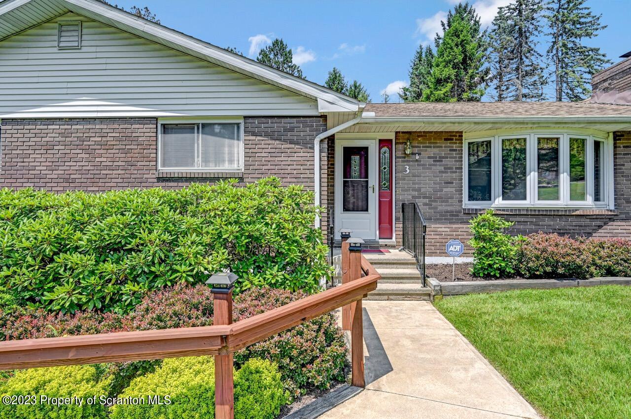 3 T-338 Moscow, PA 18444 - Photo 3 of 62 a front view of a house with a yard