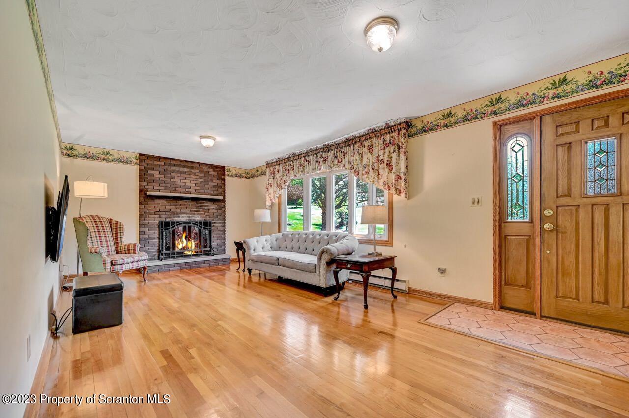 3 T-338 Moscow, PA 18444 - Photo 4 of 62 a living room with furniture and a fireplace
