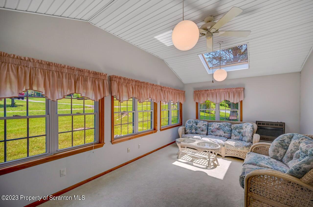 3 T-338 Moscow, PA 18444 - Photo 41 of 62 a living room with furniture and a large window