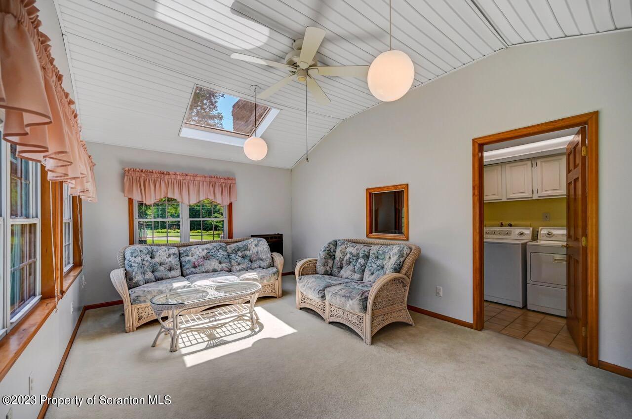 3 T-338 Moscow, PA 18444 - Photo 42 of 62 a living room with furniture and a large window
