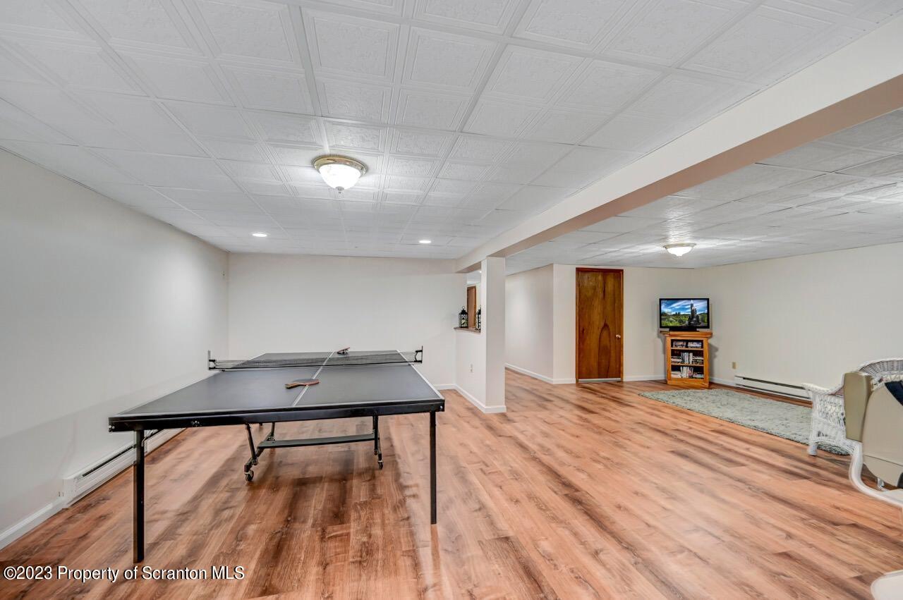 3 T-338 Moscow, PA 18444 - Photo 49 of 62 a view of a room with furniture and wooden floor