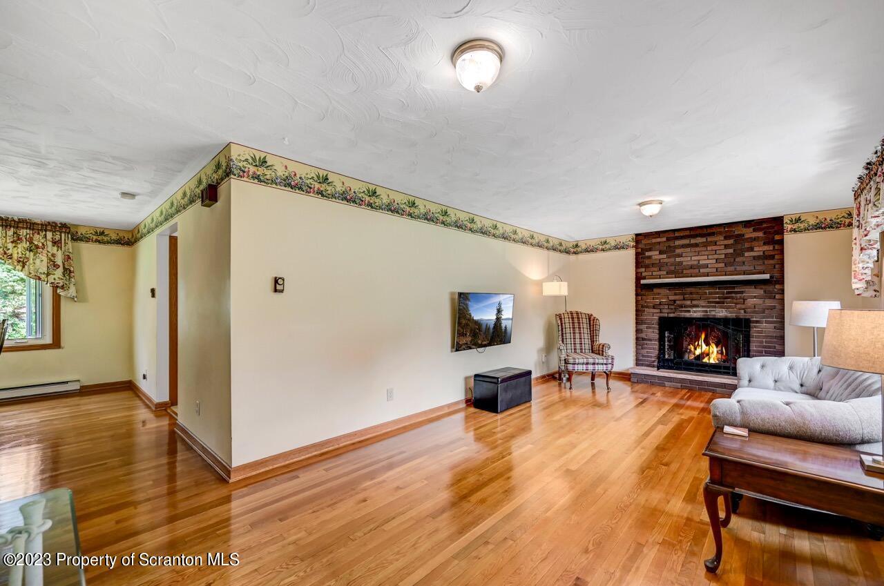 3 T-338 Moscow, PA 18444 - Photo 5 of 62 a living room with furniture and a fireplace
