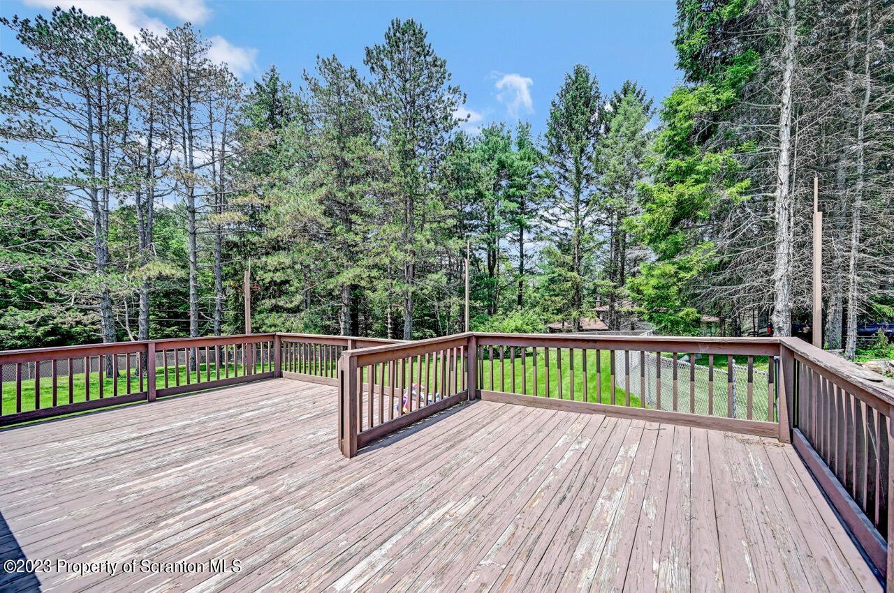 3 T-338 Moscow, PA 18444 - Photo 53 of 62 a view of deck with wooden floor and fence