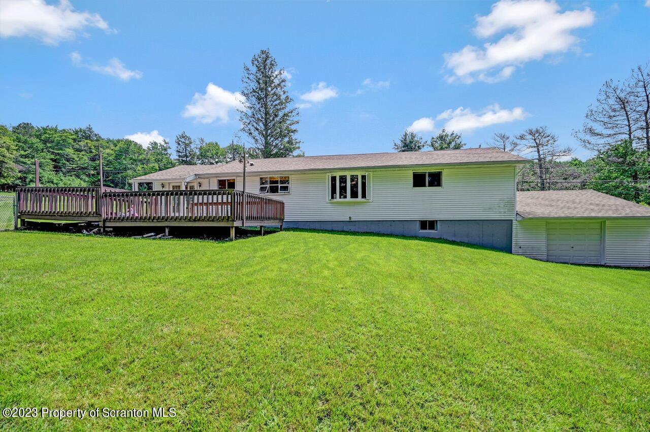 3 T-338 Moscow, PA 18444 - Photo 55 of 62 a view of a house with a backyard and a patio