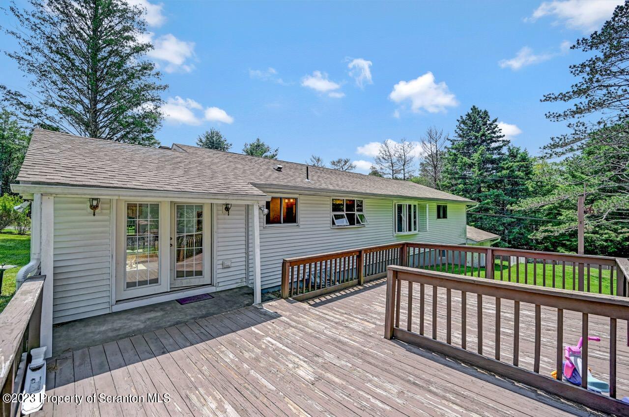 3 T-338 Moscow, PA 18444 - Photo 57 of 62 a view of a house with a wooden deck