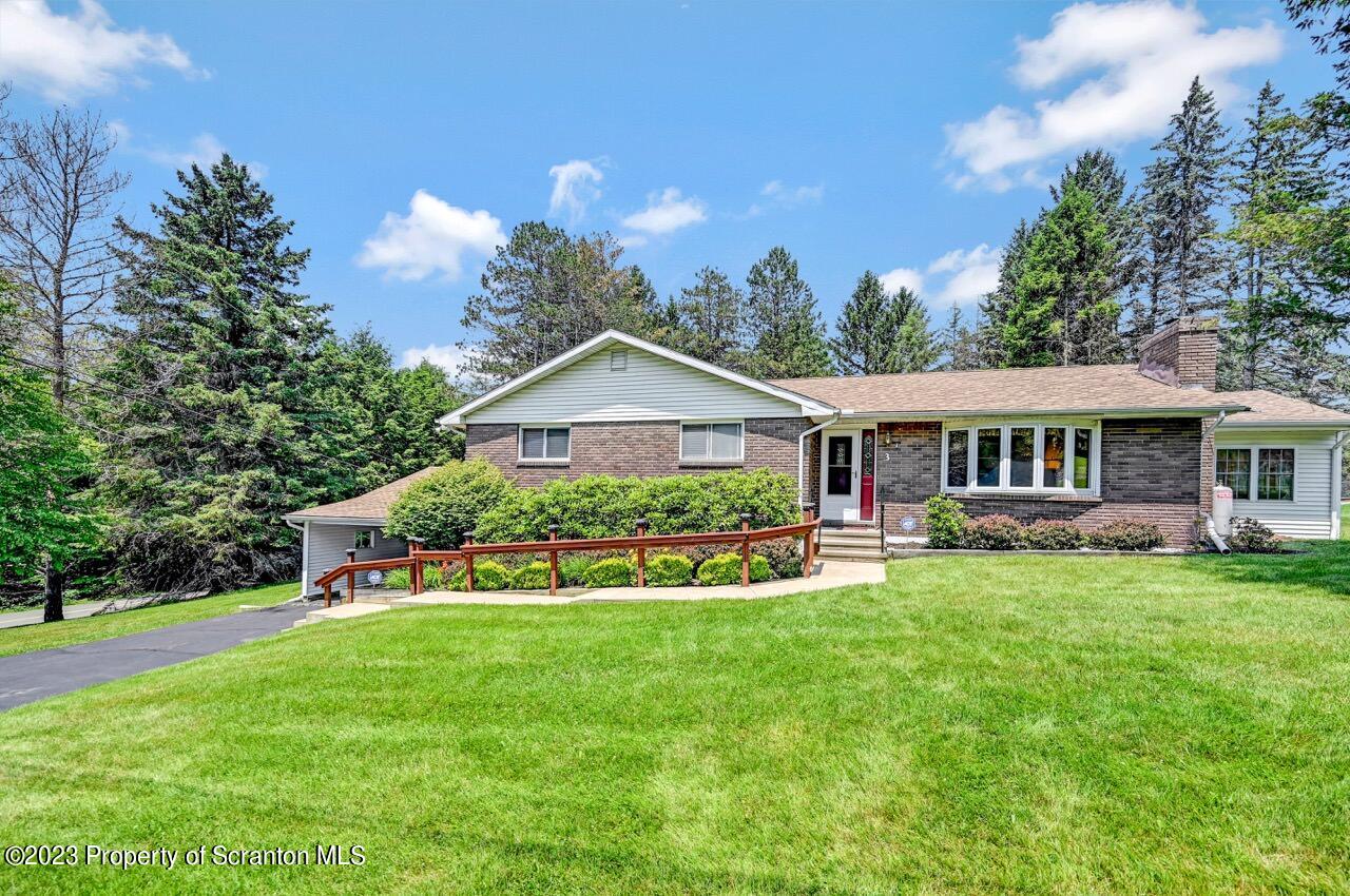 3 T-338 Moscow, PA 18444 - Photo 59 of 62 a front view of a house with garden