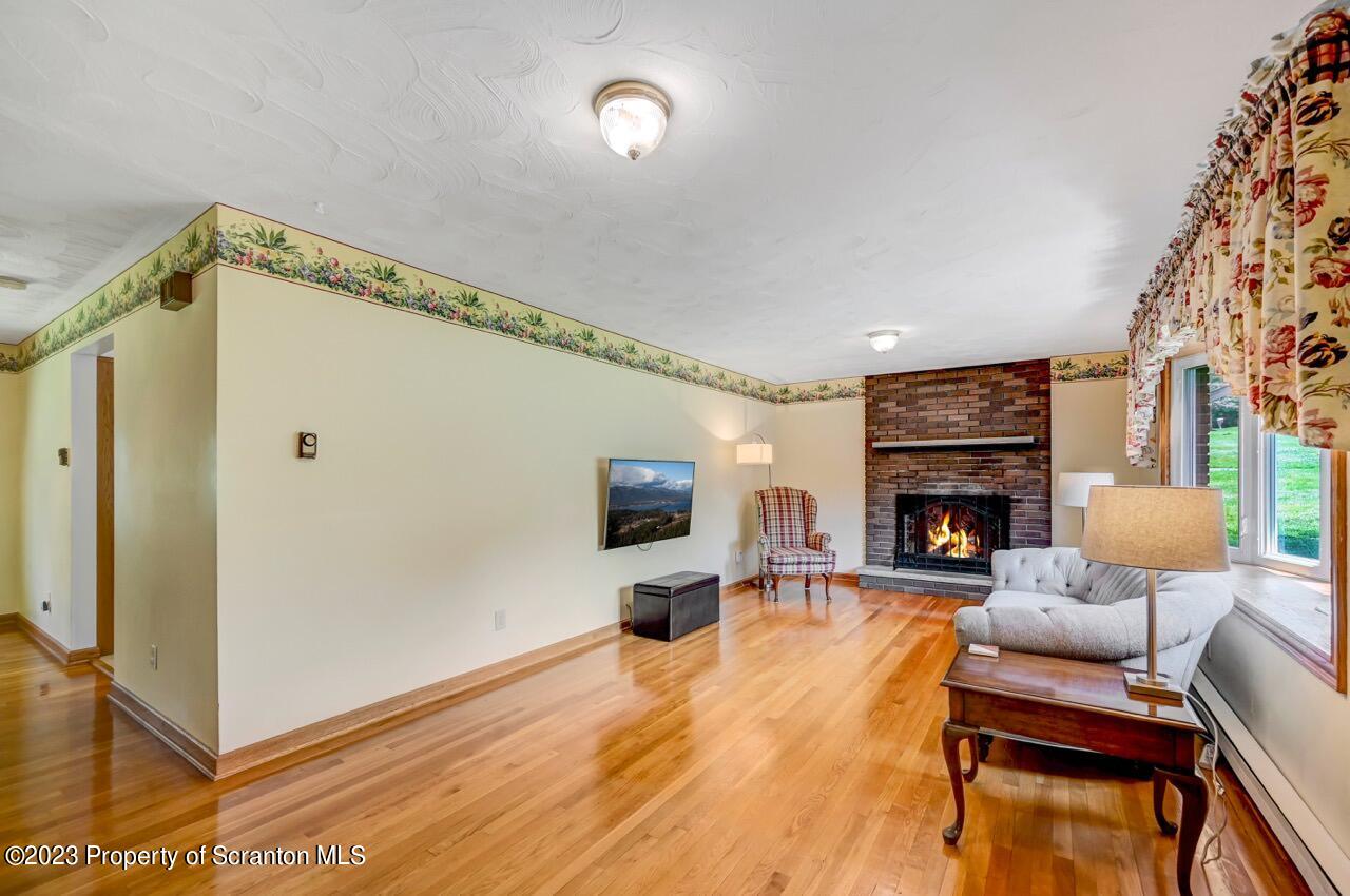 3 T-338 Moscow, PA 18444 - Photo 6 of 62 a living room with furniture and a fireplace