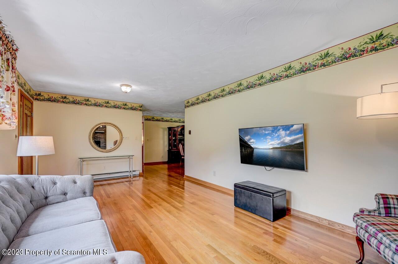 3 T-338 Moscow, PA 18444 - Photo 8 of 62 a living room with furniture and a flat screen tv