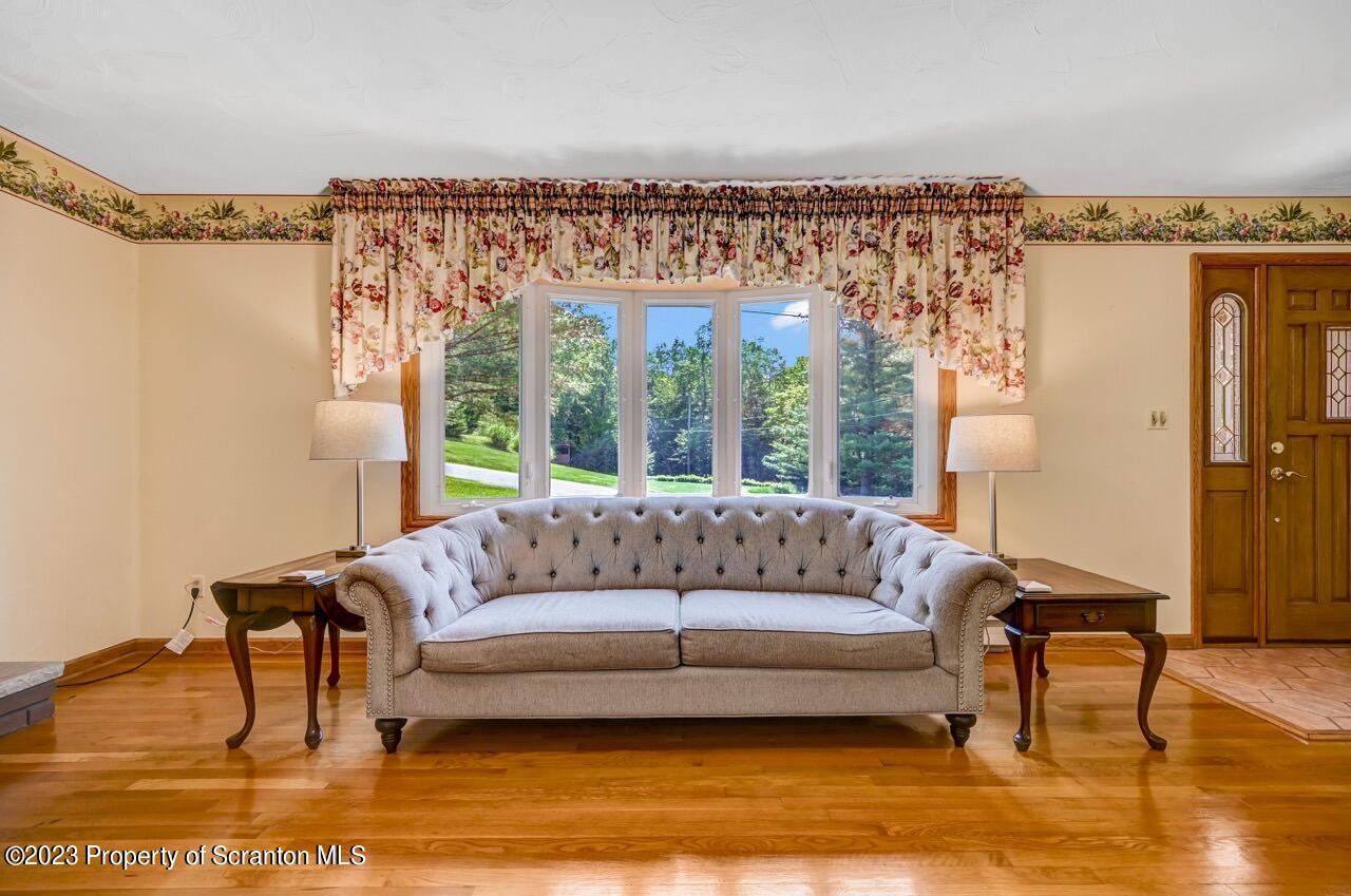 3 T-338 Moscow, PA 18444 - Photo 10 of 62 a living room with furniture and a large window