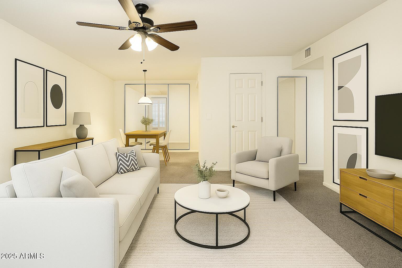 a living room with furniture and a chandelier