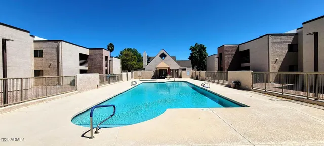 a swimming pool with a outdoor seating