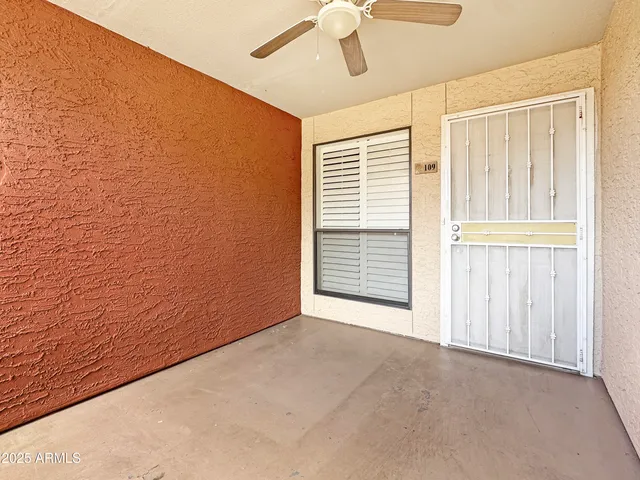 a view of an empty room with a window