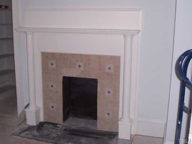 726 Gaston Street Raleigh, NC 27605 - Photo 3 of 9 Ceramic tile surrounds master bedroom fireplace.