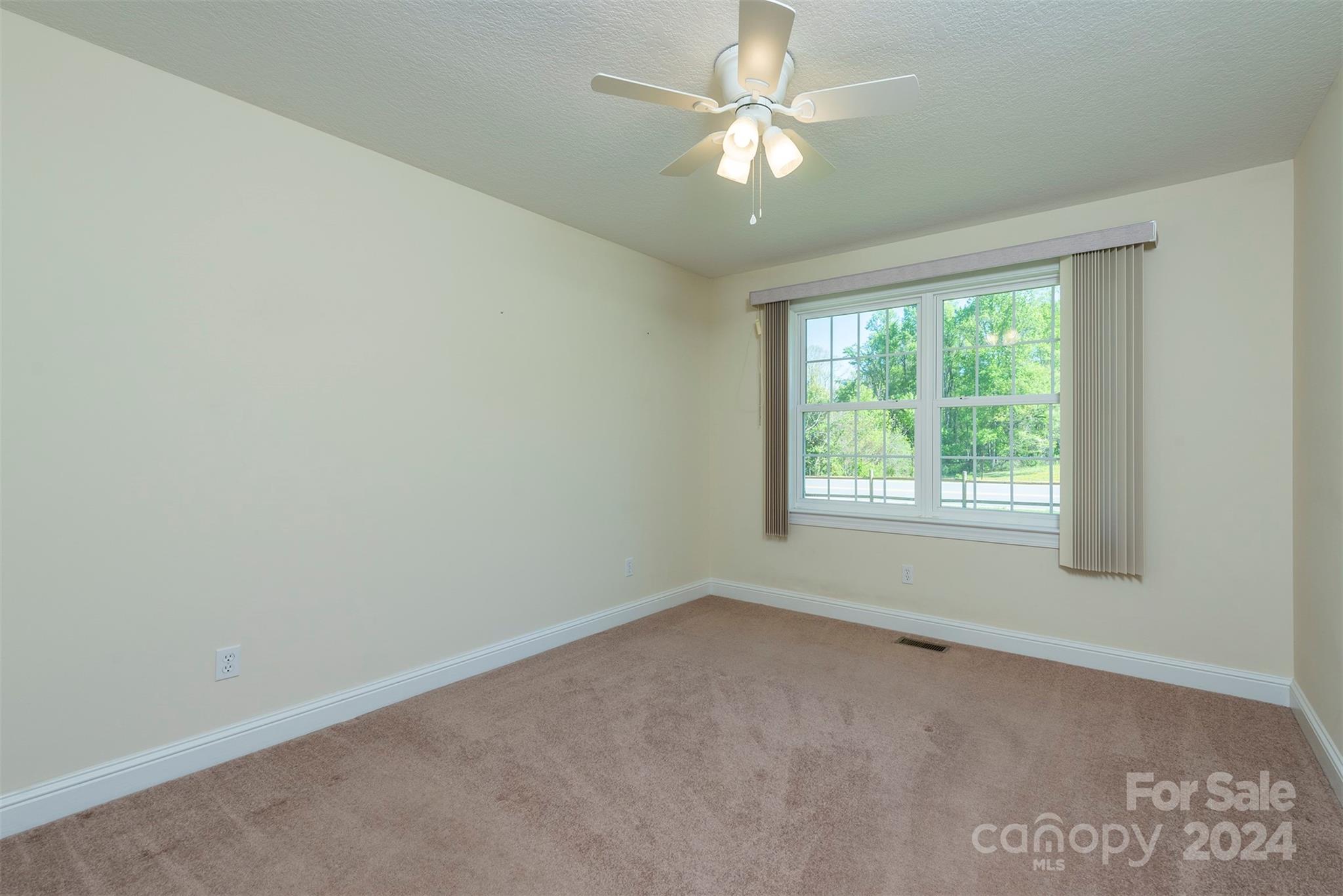 379 Buckeye Cove Road Swannanoa, NC 28778 - Photo 17 of 31 an empty room with a window