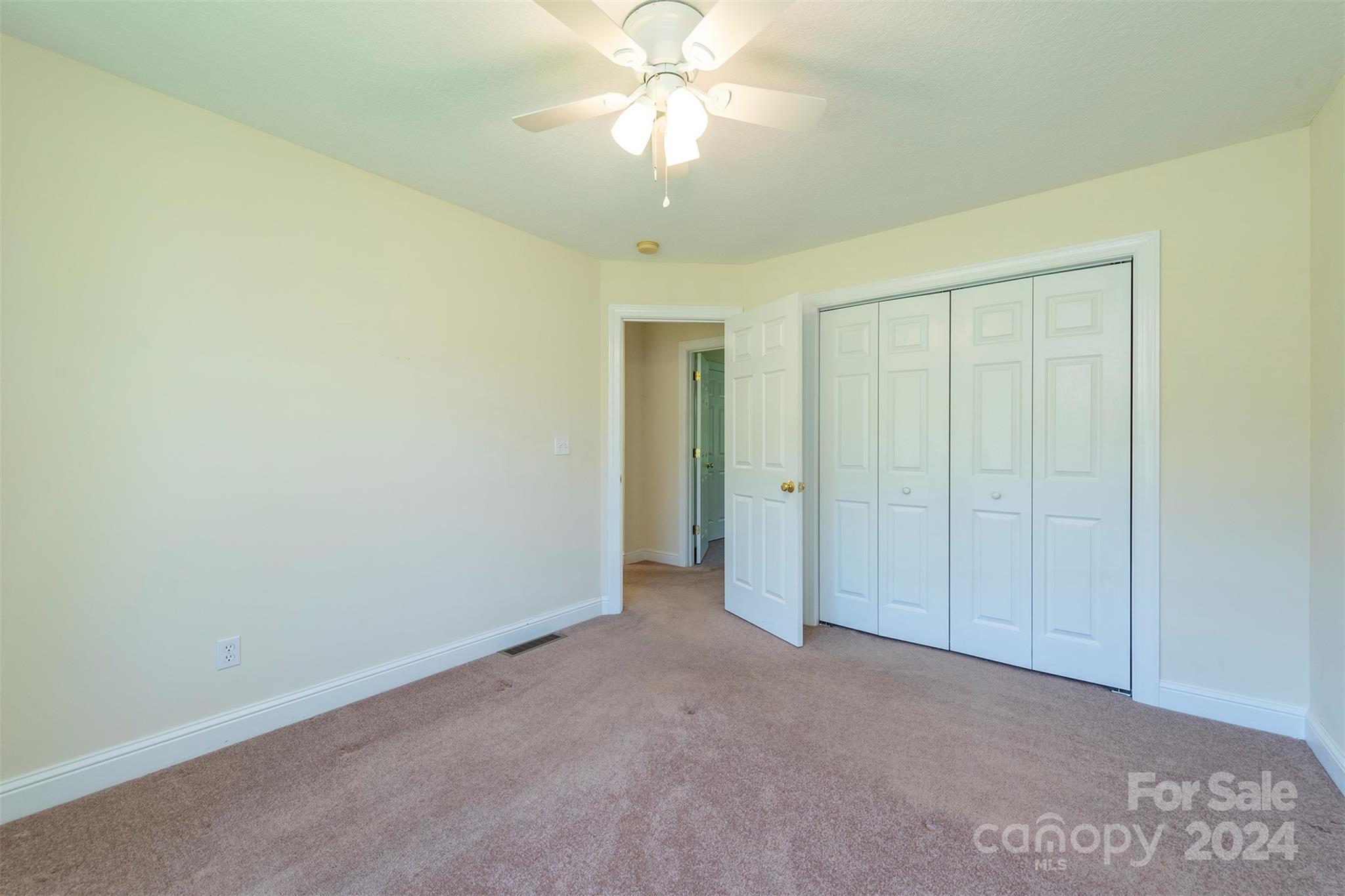 379 Buckeye Cove Road Swannanoa, NC 28778 - Photo 18 of 31 a view of an empty room and chandelier fan