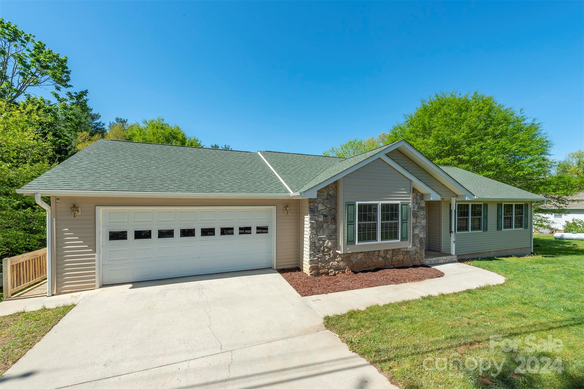 379 Buckeye Cove Road Swannanoa, NC 28778 - Photo 2 of 31 a view of house with yard and green space