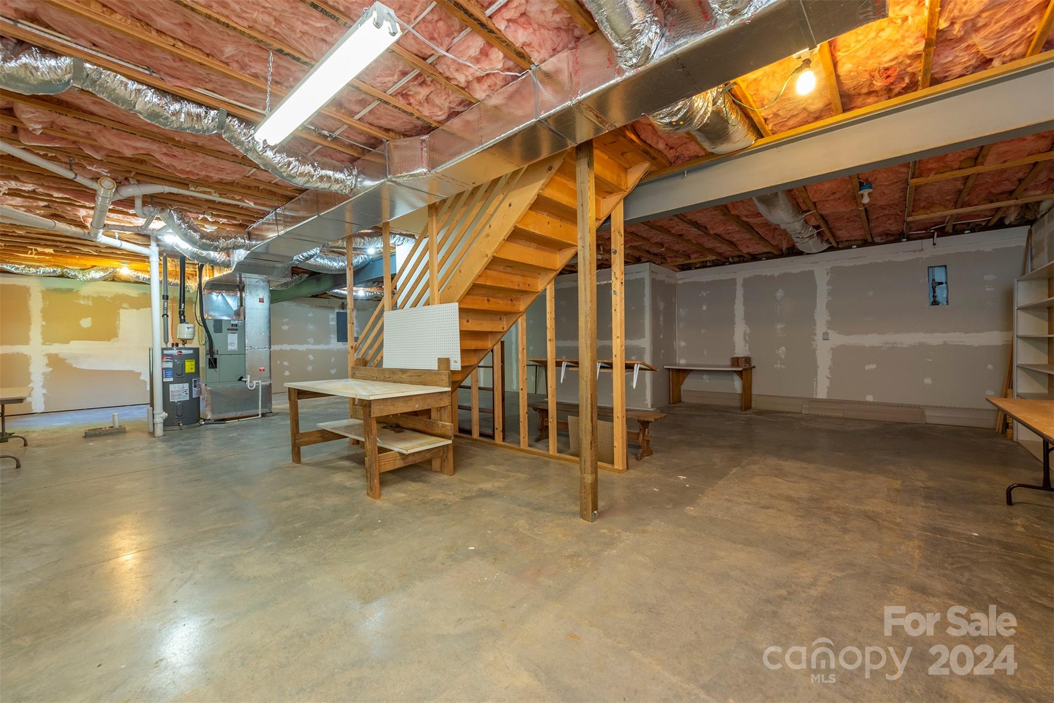 379 Buckeye Cove Road Swannanoa, NC 28778 - Photo 21 of 31 a view of an empty room with wooden walls