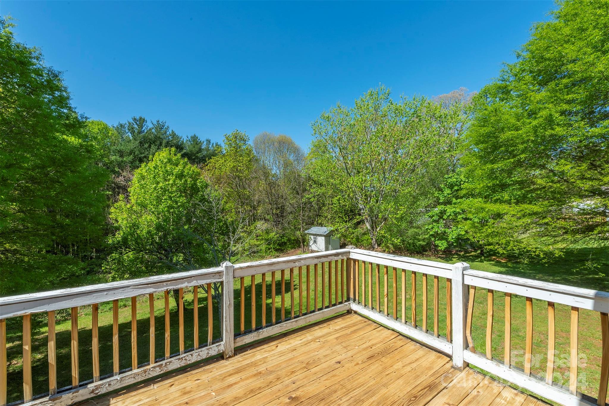 379 Buckeye Cove Road Swannanoa, NC 28778 - Photo 28 of 31 a balcony with trees in front of it