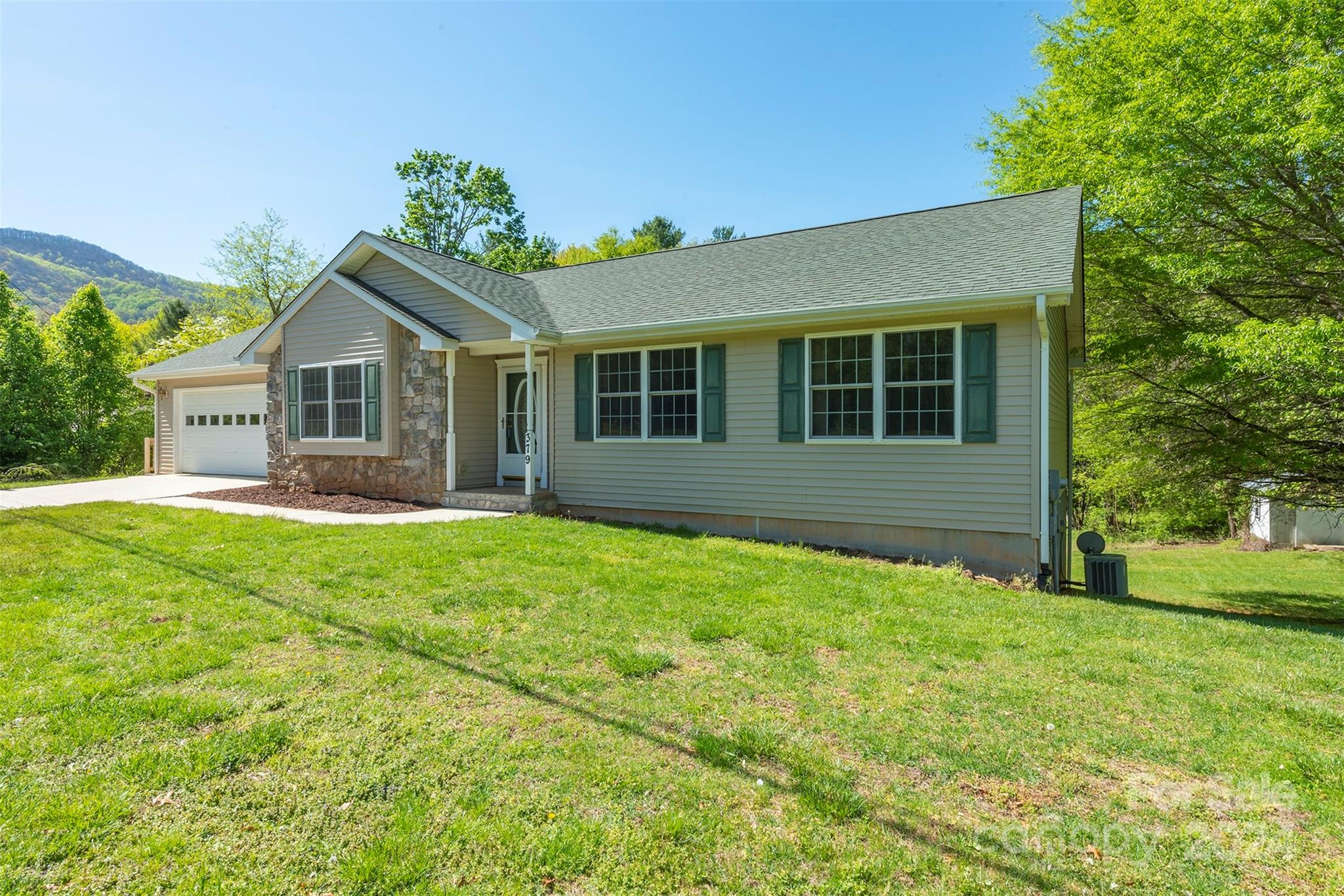 379 Buckeye Cove Road Swannanoa, NC 28778 - Photo 3 of 31 a view of front of a house with a yard