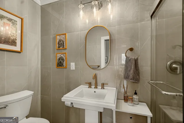 a view of a livingroom with furniture window and wooden floor