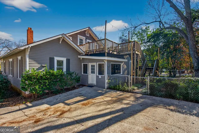 a view of a house with a yard and garage