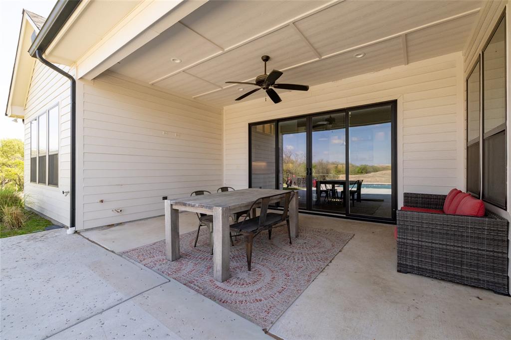 338 County Road 4223 Decatur, TX 76234 - Photo 34 of 37 Covered patio overlooking the pool with sliding doors that access the Kitchen. A second door accesses the Sunroom.