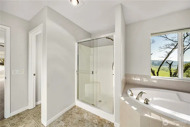 a bathroom with a tub and a sink