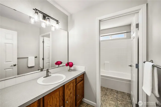 a bathroom with a sink and a mirror