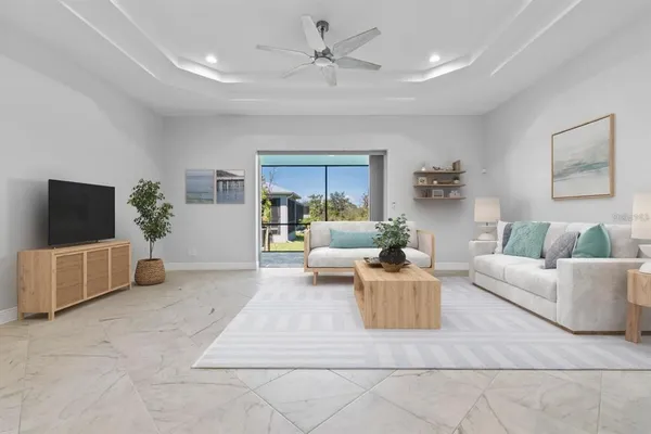 a living room with furniture and a large window