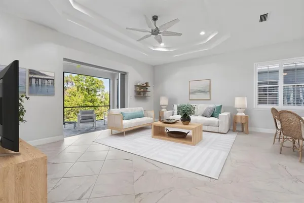 a bedroom with furniture and a chandelier