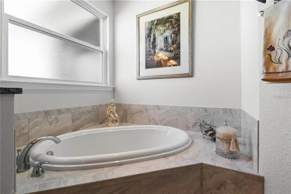 a bathroom with a bathtub and shower