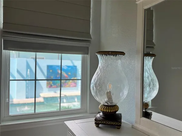 a living room with furniture a flat screen tv and a window